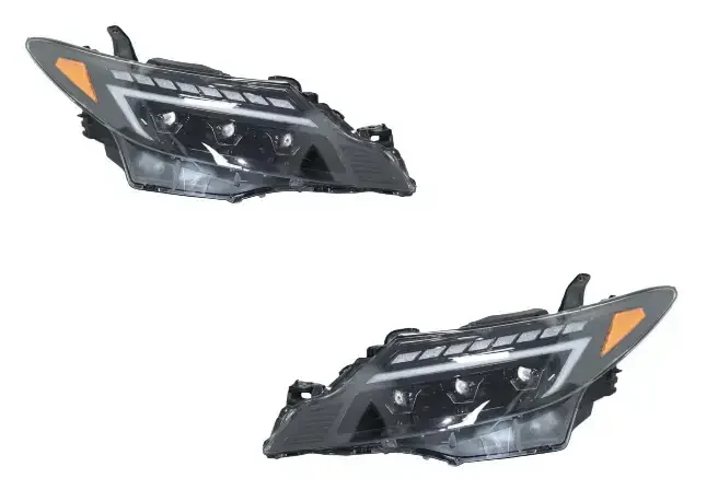 Pair of automotive headlight assemblies from the Previa Estima range